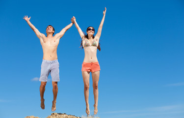 Happy Young Couple Together On The Beach