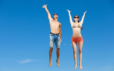 Happy Young Couple Together On The Beach