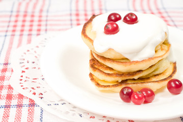 Obraz na płótnie Canvas sweet pancakes with sour cream