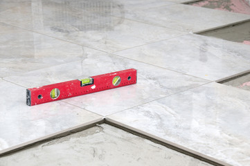 Fototapeta premium level gray Tiles on a floor