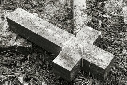 Fallen cross at a cemetery