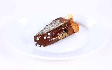 Slice of a bundt cake with chocolate & sugar balls