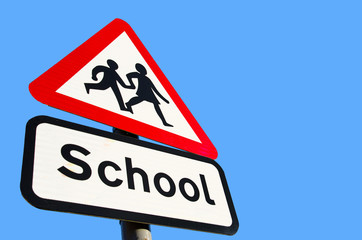 school warning sign on blue sky background