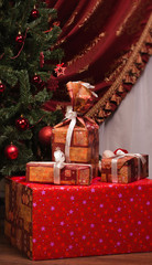Christmas. Gifts on a fir branches background