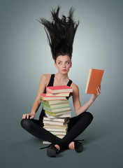 Sexy young woman reading a book, concept of fantasy