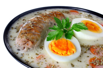 Delicious sour soup with egg and sausage