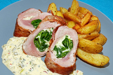 Pork tenderloin filled with spinach and mozzarella cheese