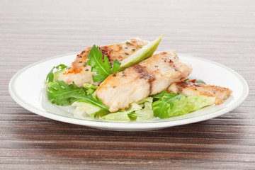Grilled fish and fresh salad.
