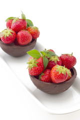 Hand made chocolate cup filled with fresh starwberry isolated on