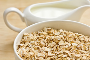 Oat flakes in bowl  and milk