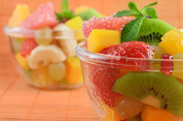 Healthy mixed fruit salad in the glass bowl