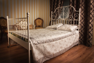 Bed in the elegant bedroom
