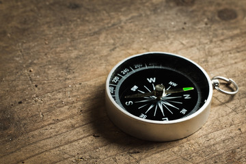 Compass on a wood table