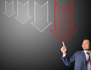 Business man touching decreasing arrow