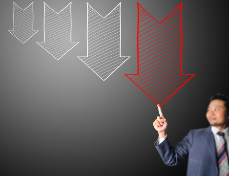 Business man touching decreasing arrow