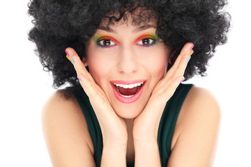 Surprised woman with afro wig