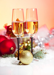 New Year and Christmas Celebration .Two Champagne Glasses in Hol