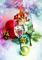 New Year and Christmas Celebration .Two Champagne Glasses in Hol