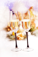New Year and Christmas Celebration .Two Champagne Glasses in Hol