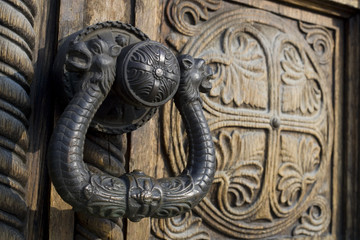 Ornate wooden doors, door hardware of Aleksandar Nevski church