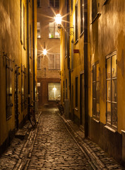 Narrow street in Stockholm Old town at night.