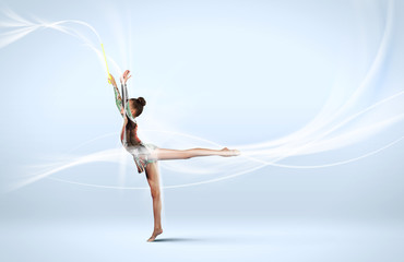 Fototapeta na wymiar Young woman in gymnast suit posing