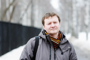 Outdoors portrait of courageous middle age man