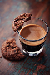 Glass of espresso and chocolate cookie