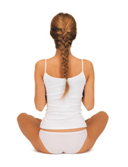 woman in undrewear practicing yoga lotus pose