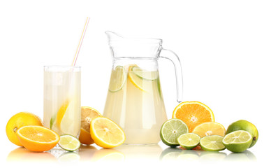 Citrus lemonade in pitcher and glass of citrus around isolated