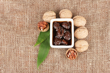 jam walnuts in a bowl on sacking