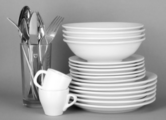 Clean white dishes on grey background