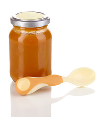Useful and tasty baby food with beige small spoon  isolated