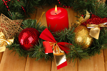 Christmas composition  with candle and decorations in red and