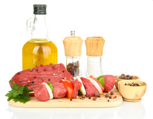 Raw beef meat marinated with herbs and spices isolated on white