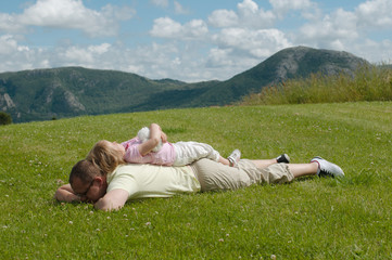 Father and child on the grass