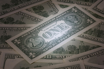 Background with American dollar bills with mysterious light