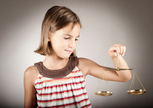 Girl Holding Justice Scale