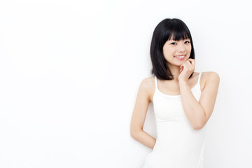 attractive asian woman relxing on white background