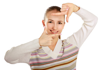 A young pretty girl framing her face with her hands