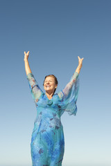 Portrait joyful mature woman isolated sky