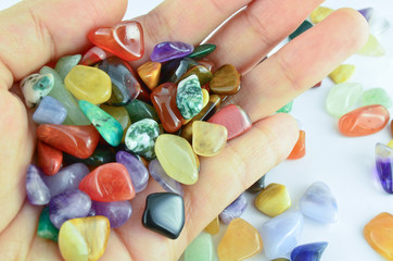Hand holding colorful stones