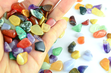 Hand holding colorful stones