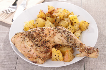 grilled chicken leg and potatoes