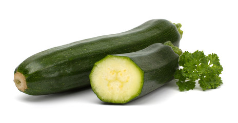 Two fresh vegetable zucchini isolated on white background.
