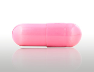 close-up of pink medical capsule