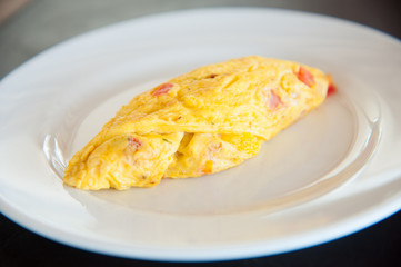 Omelete egg on white dish