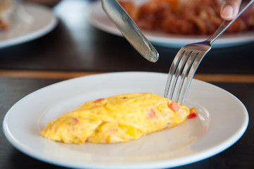 Omelete egg on white dish