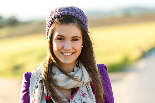 Close up portrait of cute teen girl outdoors.