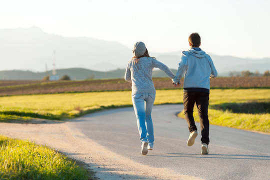 Couple running outdoors.